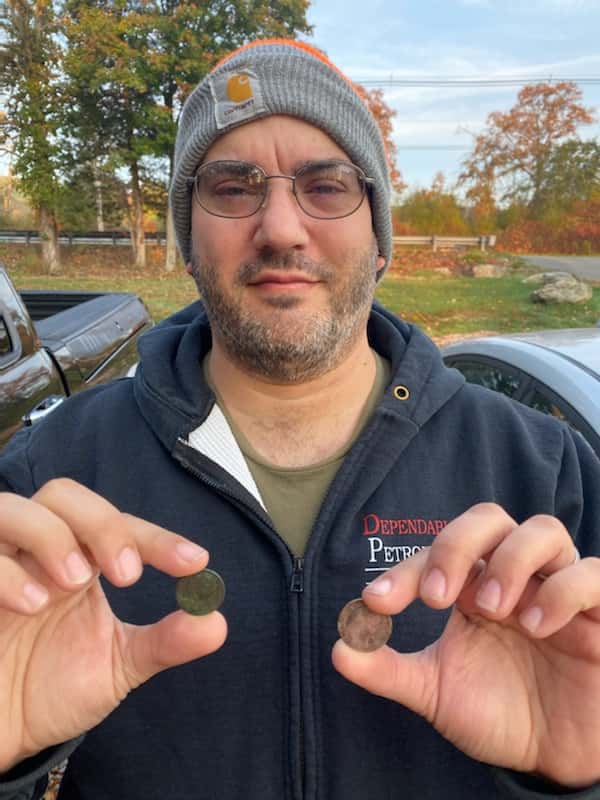 Farthing and Shilling on Lichen Rock Background