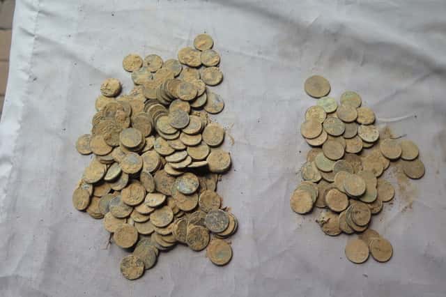 Piles of Dirty Pennies on Blue Cloth