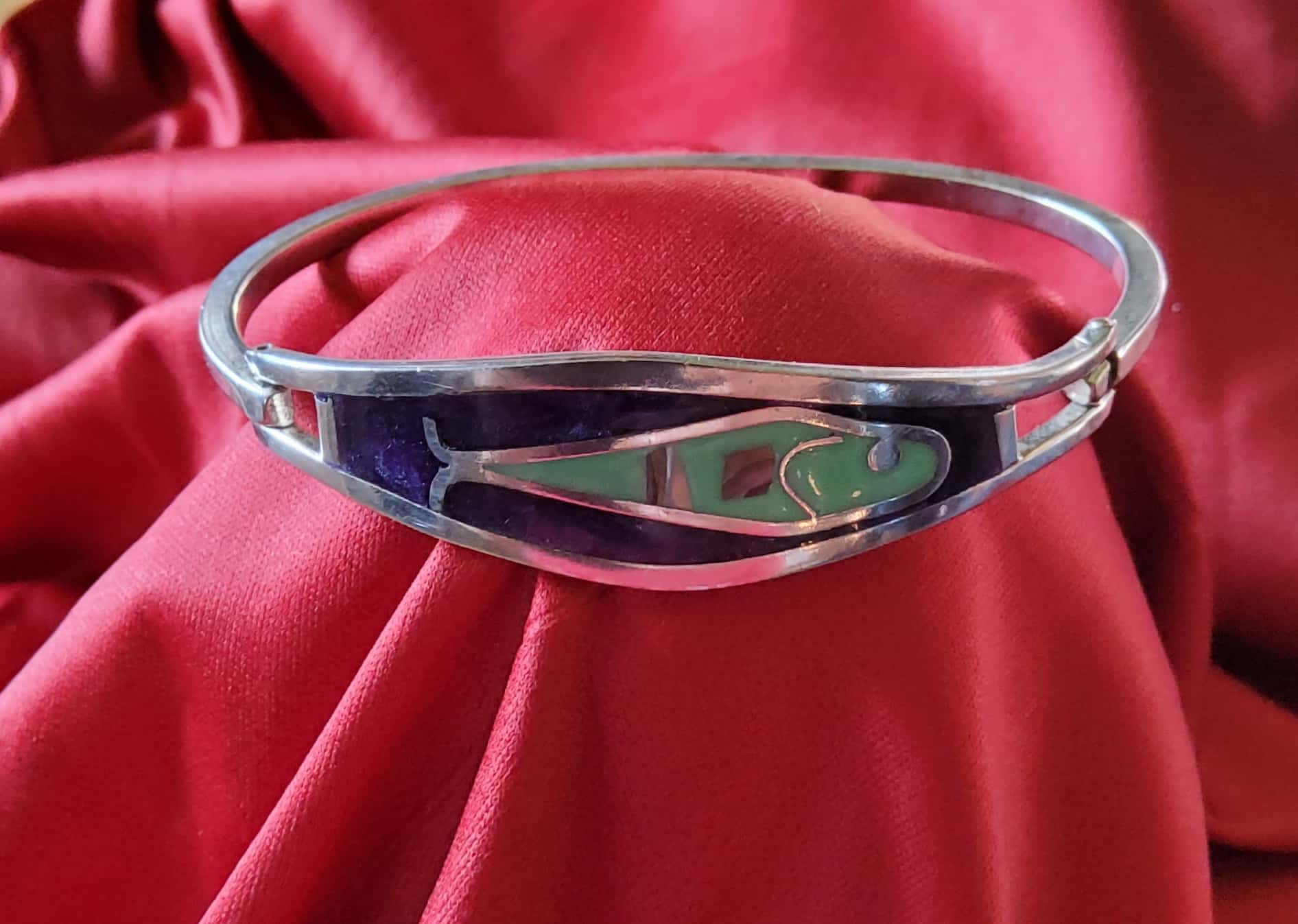 Gold Skull Pin Encrusted in Gems with Ruby Red Eyes on Paper Towel Background