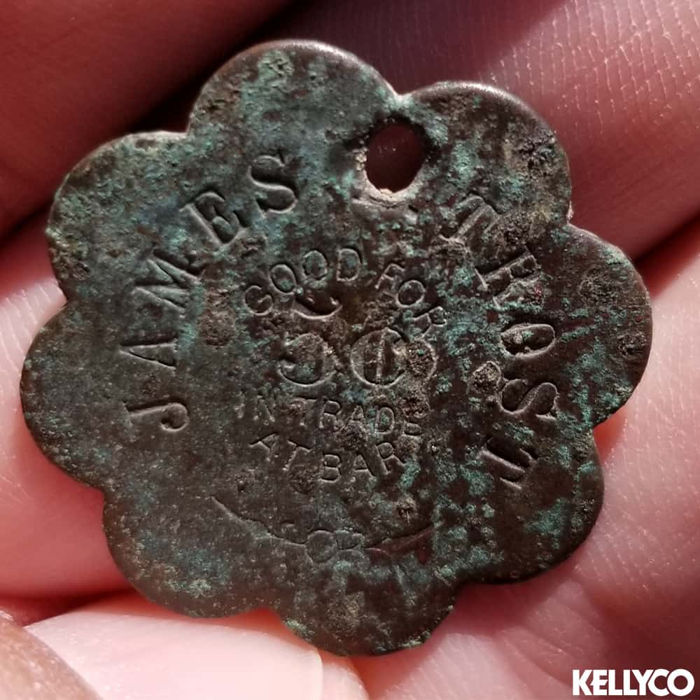 Image of Token with Scallopped Edges REading James Trost Good for 5c in Trade at Bar