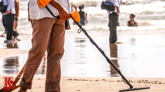 A detectorist using a Garrett metal detector.